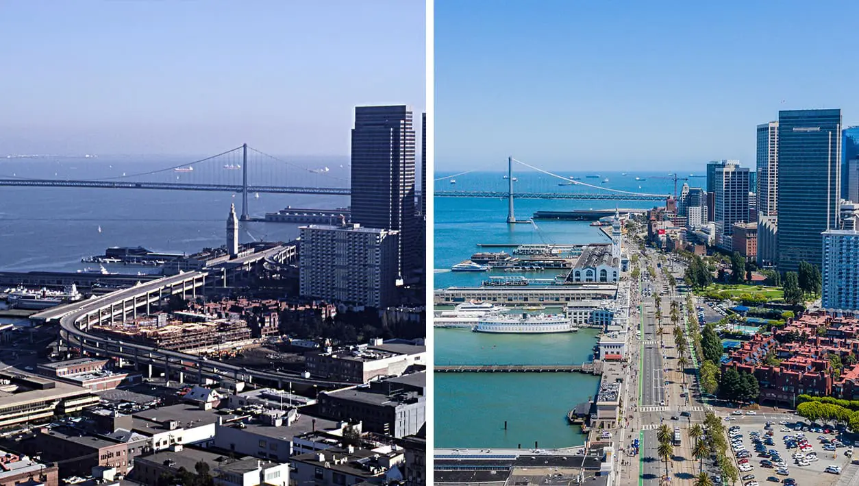 A view of San Francisco’s Embarcadero after the freeway was replaced: a wide boulevard with car lanes, a streetcar line, broad sidewalks lined with palm trees, and bustling development with shops, housing, and pedestrians.