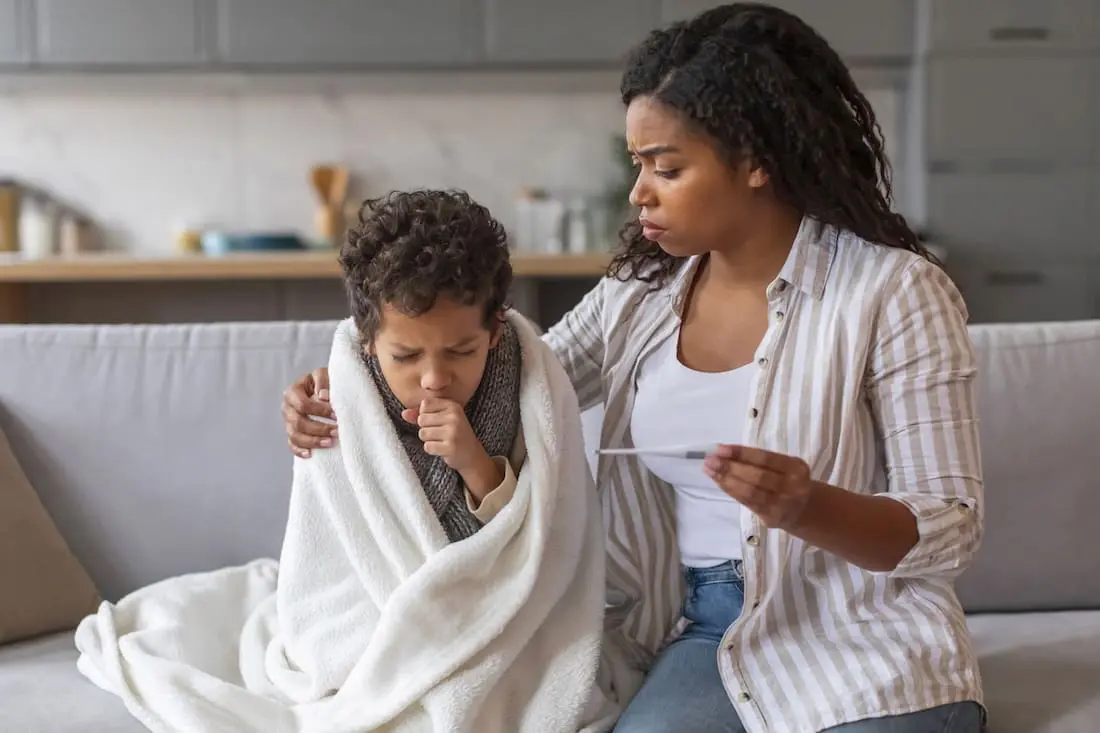 Worried mother with a sick child.
